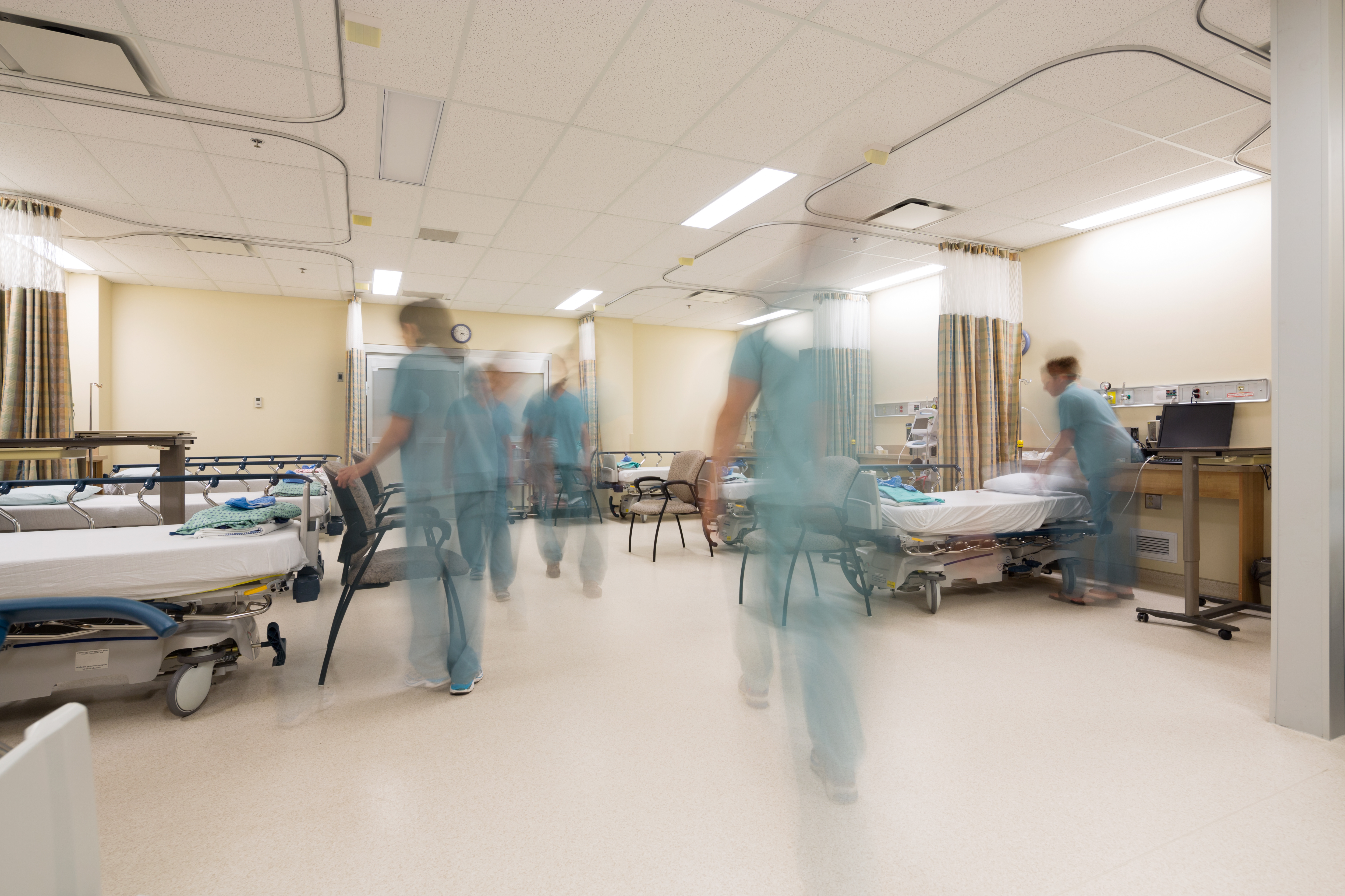 Blurred motion of nurses working in PACU unit