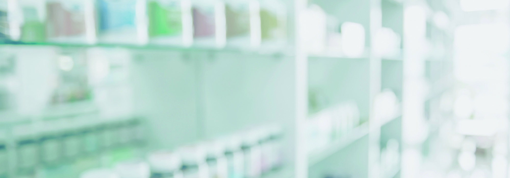 Pharmacy blurred light tone with store drugs shelves interior background, Concept of pharmacist and chemist.